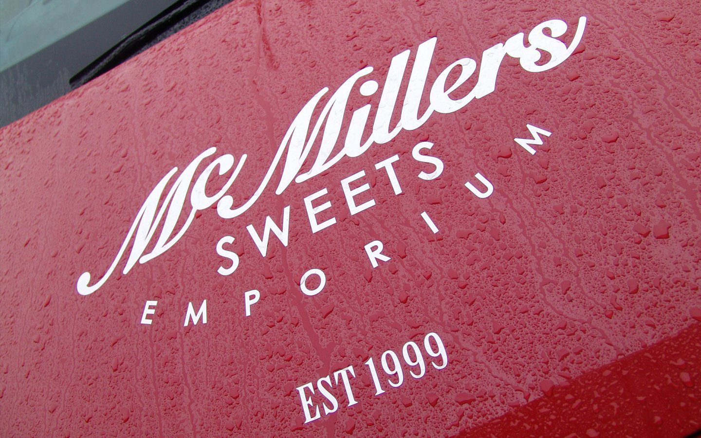 McMillers Sweets Emporium Logo Design Mono Simplified on Car